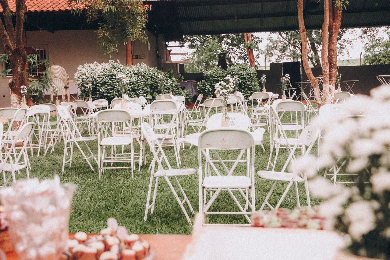 Illustrative photo: outdoor celebration with white chairs