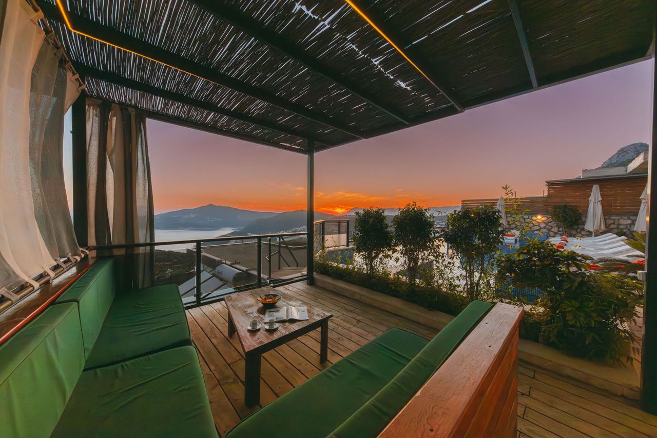 Illustrative photo: terrace with a sea view at sunset